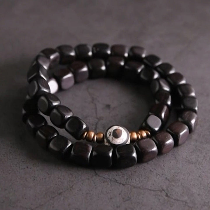 Schwarzes Ebenholz Armband mit Kupperperlen und Steinanhänger elegant