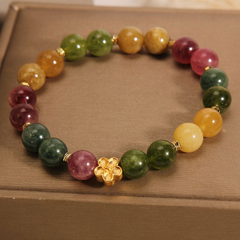 Buntes Turmalin Armband mit goldener Blume Naturstein Perlen elastisch.