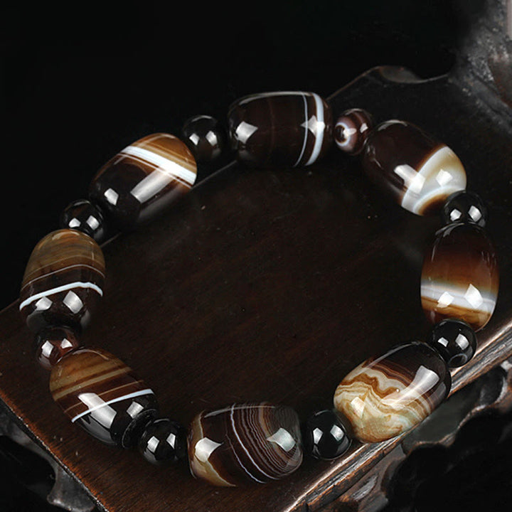 Armband Onyx – Glück & Mut mit braunen Steinen und schwarzen Perlen elegant.