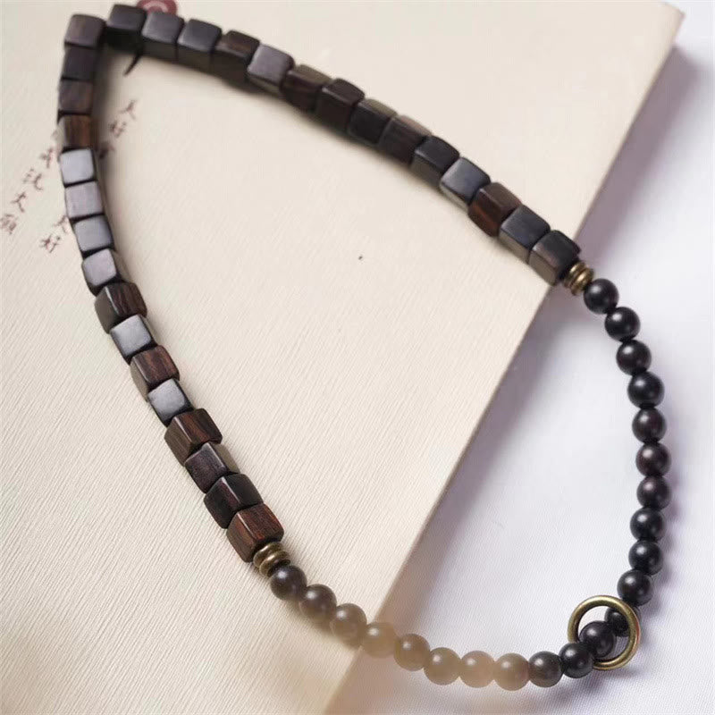 Armband Ebenholz – Frieden mit quadratischen Holzperlen und schwarzen Kugeln