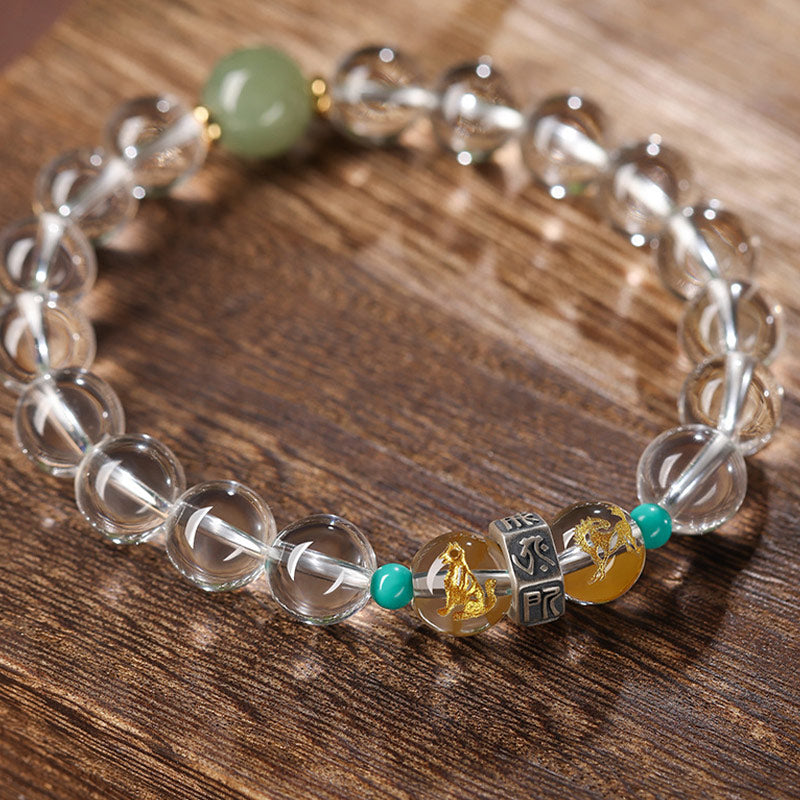 Armband mit transparenten Kristallperlen und grünem Stein elastisch