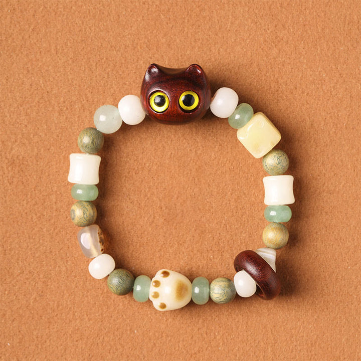 Armband Sandelholz Bodhi Katze mit grünen und weißen Perlen Frieden