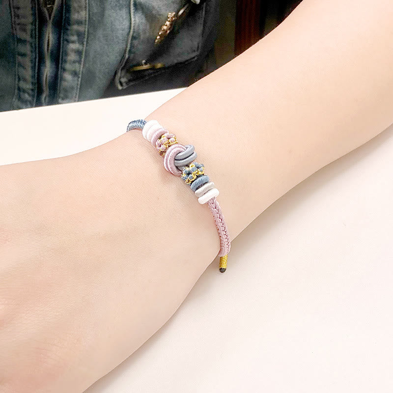 Armband – Glück & Frieden rosafarbenes Seil bunte Perlen Handgelenk