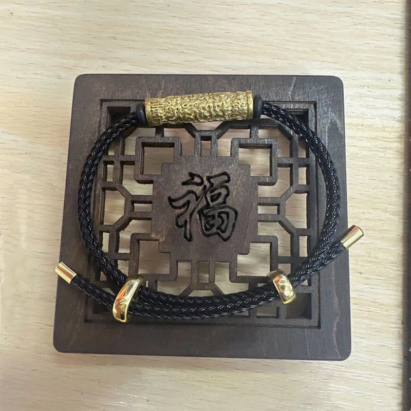 Armband – Schutz & Stärke schwarzes Seil Holzplakette chinesisches Zeichen