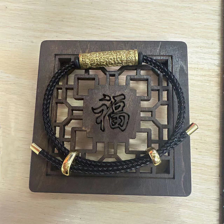Armband – Schutz & Stärke schwarzes Seil Holzplakette chinesisches Zeichen