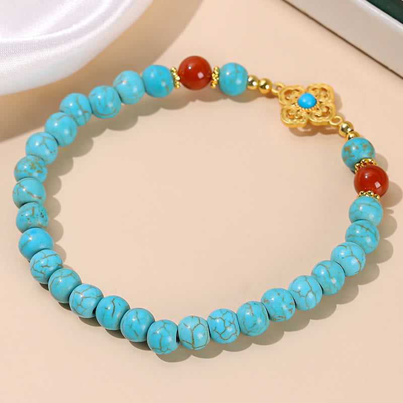 Armband Türkis – Schutz & Balance, elegantes Design mit roten Akzenten