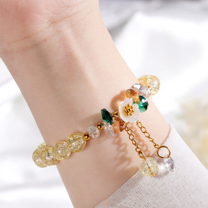 Armband Blume Glas mit Perlen und goldenen Kettenelementen