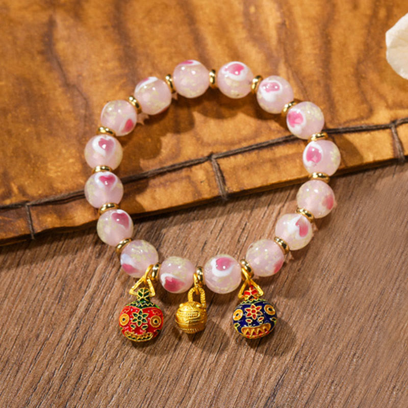 Armband – Liebe & Segen rosafarbene Perlen goldene Charm Anhänger elegant