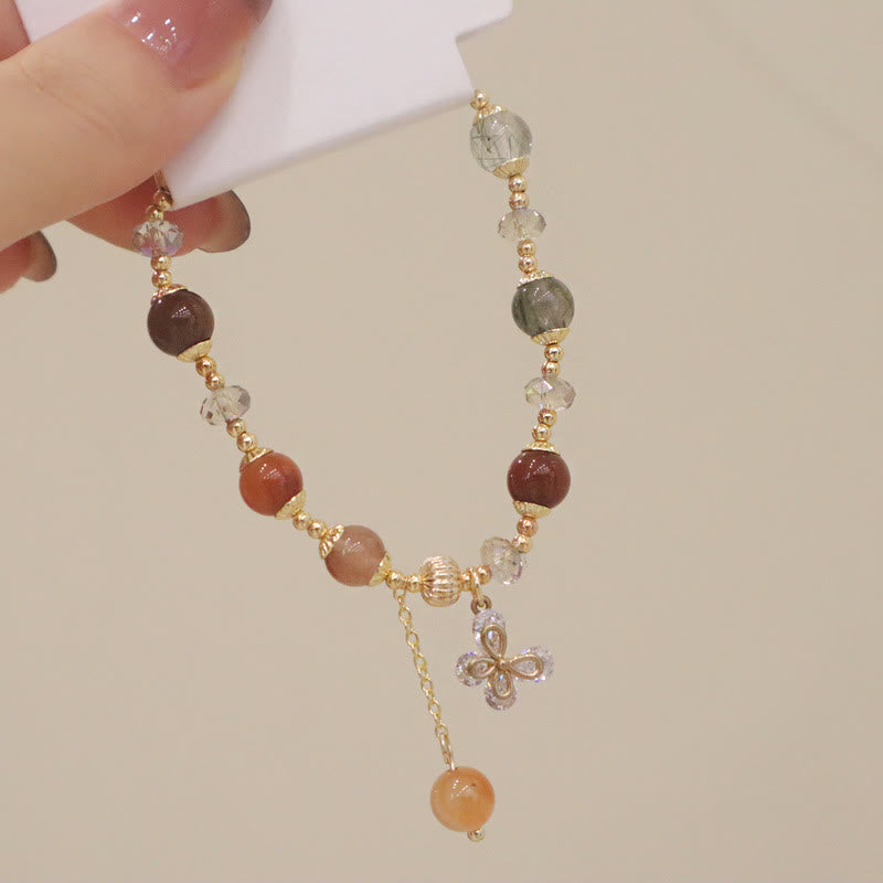 Armband Kristall Schmetterling – Wohlstand mit Natursteinen elegant getragen.