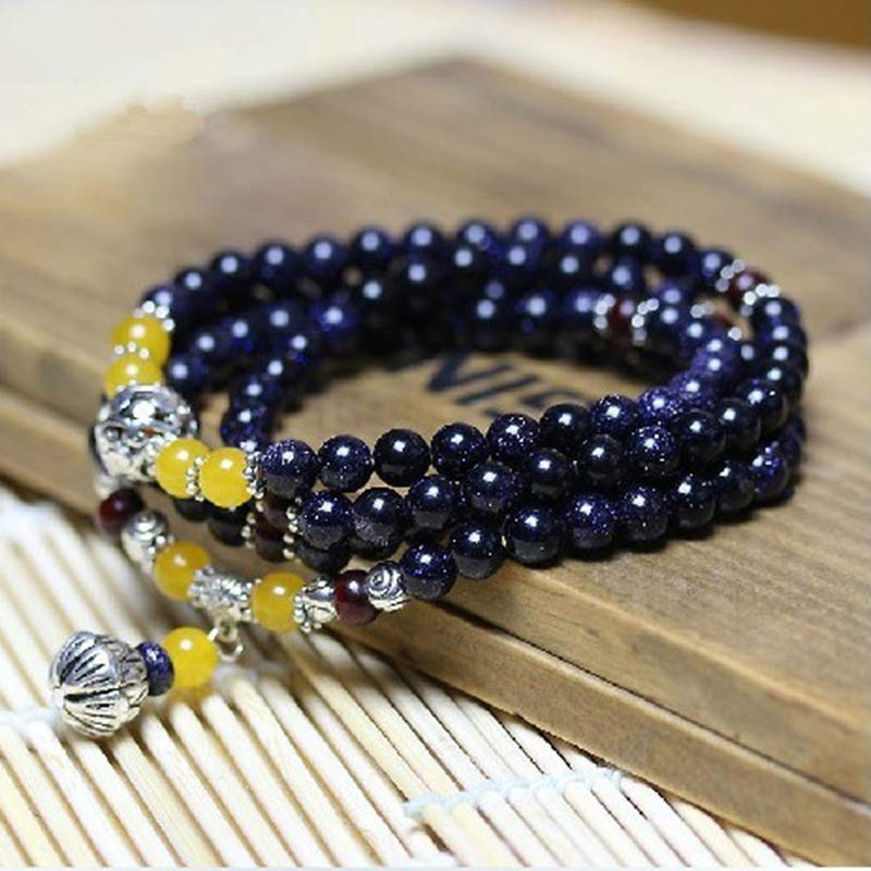 Mala – Wohlstand Armband mit dunkelblauen Steinen und gelben Perlen elastisch.