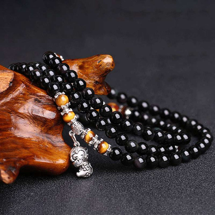 Schwarzes Obsidian Armband mit Tigerauge und silbernem Charm Anhänger