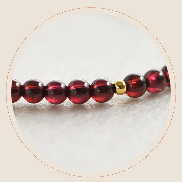 Armband Granat rote Perlen golden Stabilität Elastisch glänzend