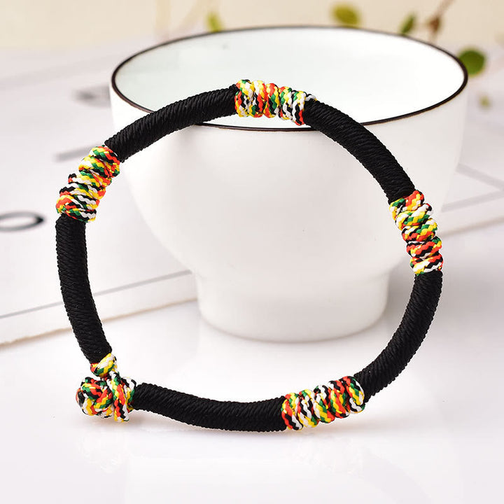 Armband – Schutz & Glück Balance schwarzes Seil bunte Perlen elastisch