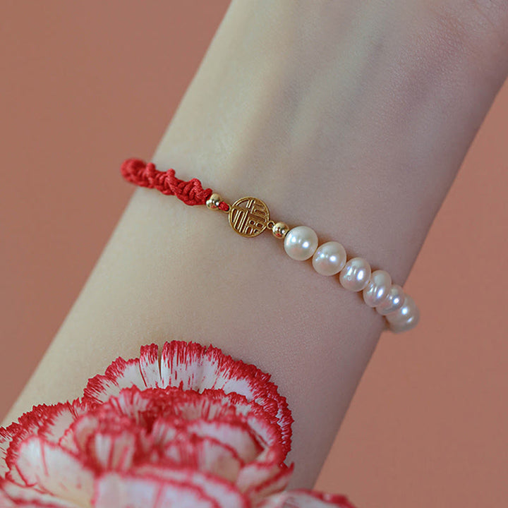 Armband Perle – Schutz & Glück rotes Seil Perlen gold Handgelenk