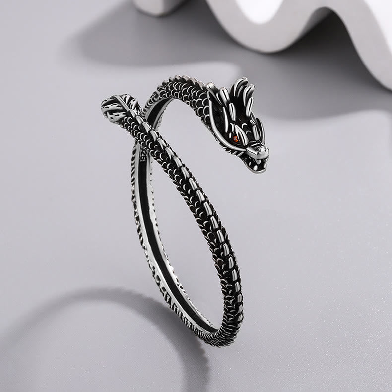 Silbernes Drachen-Armband mit detailliertem Kopf und Schuppen-Design.