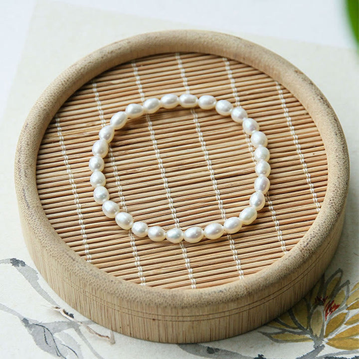 Armband Perle – Heilung weiße Perlen elastisch Holzschale Dekoration