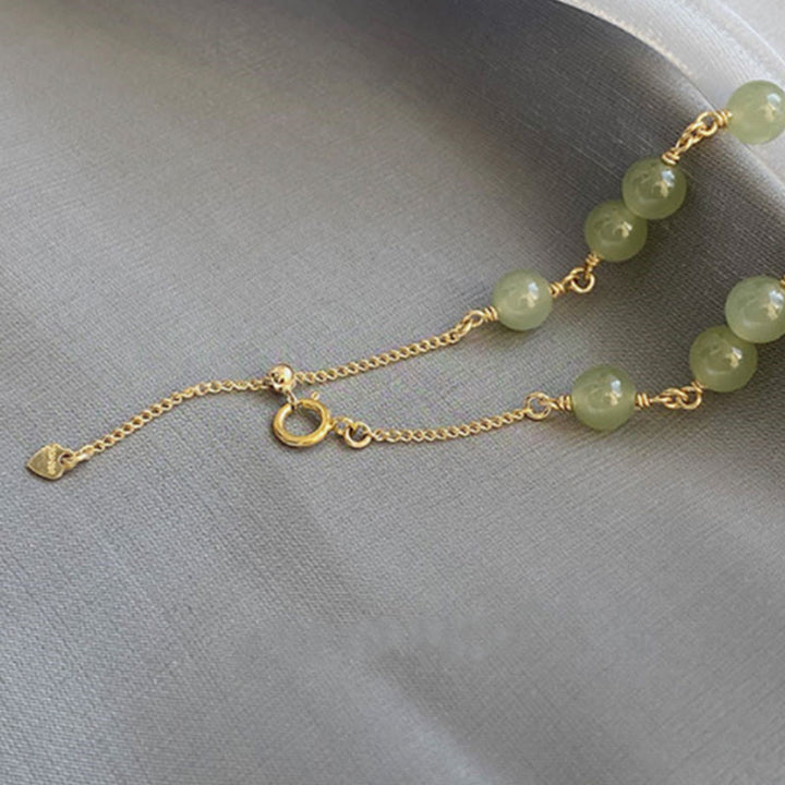 Armband Jade Gold – Wohlstand grüne Jade Perlen goldene Kette elegant