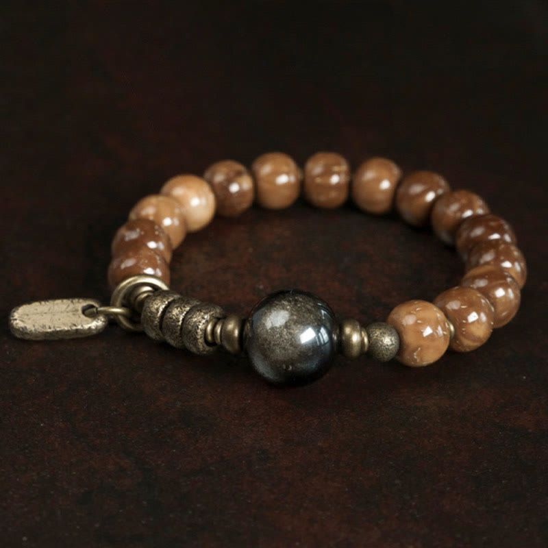 Armband Tigerauge Obsidian mit metallischen Perlen und Anhänger.