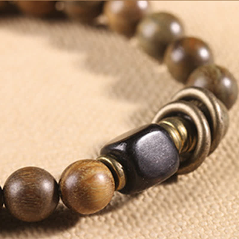 Armband Sandelholz Kristall Frieden braune Holzperlen schwarzer Stein elastisch