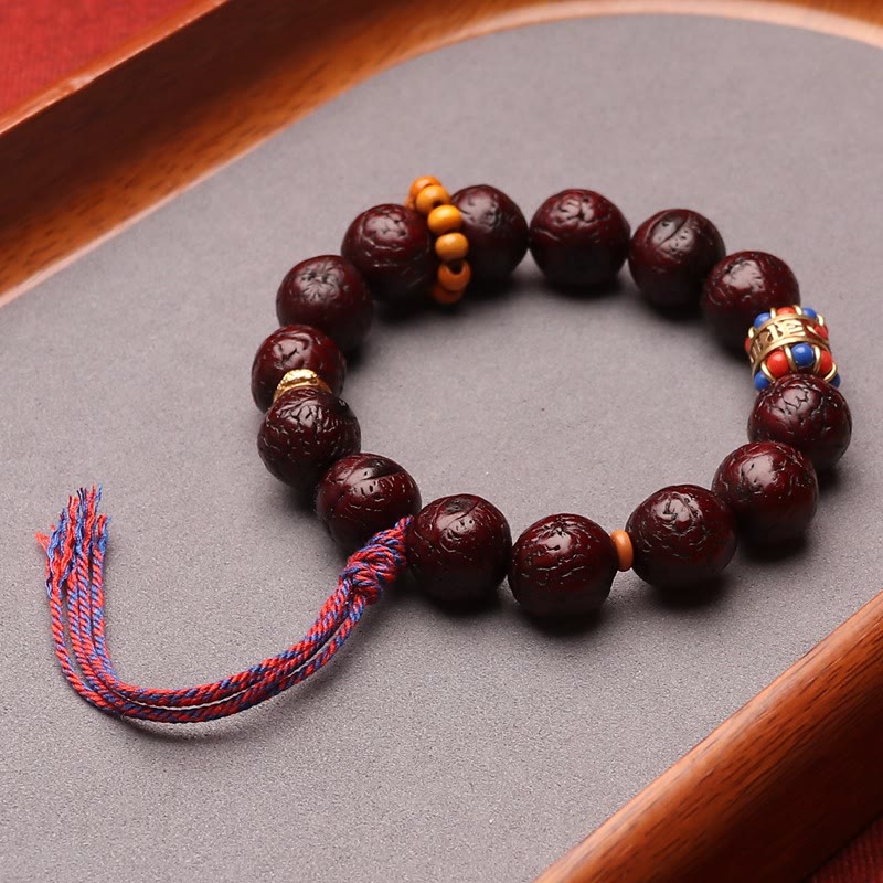 Bodhi Armband mit dunklen Perlen und farbigem Quasten Schmuck