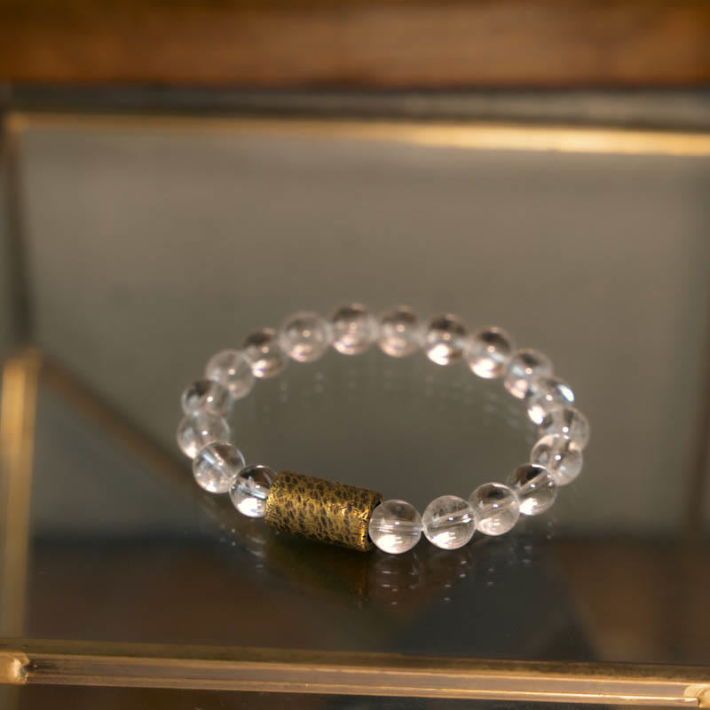 Armband Weißer Kristall – Schutz mit goldenem Zylinder Perle elastisch