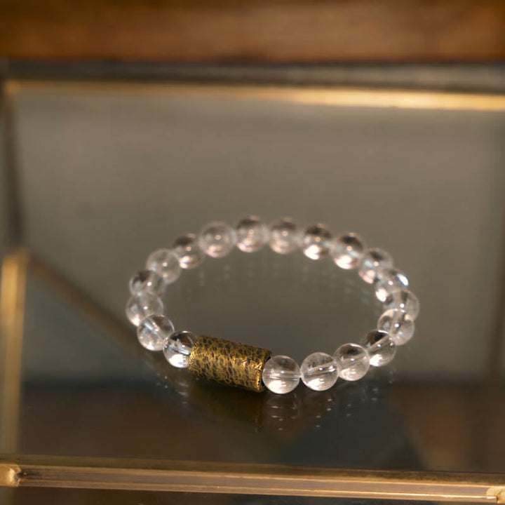 Armband Weißer Kristall – Schutz mit goldenem Zylinder Perle elastisch
