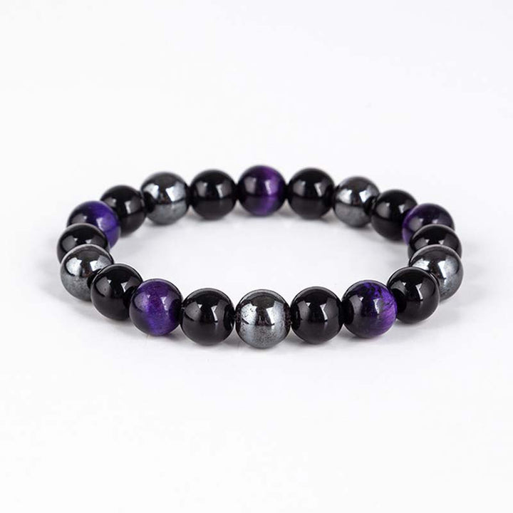Armband mit schwarzem Onyx, Tigerauge und lila Amethyst Steinen