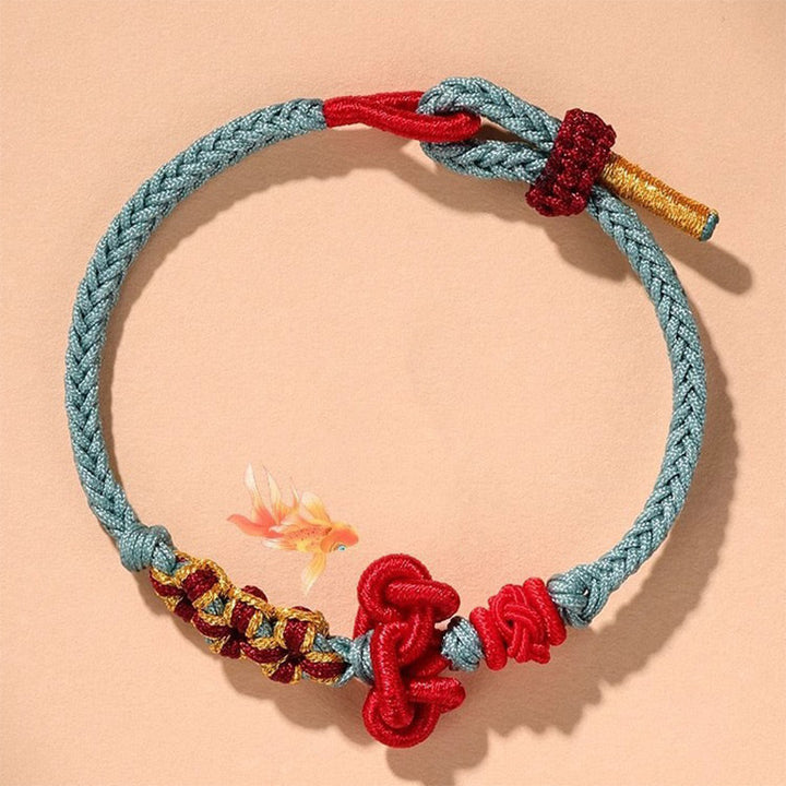 Armband – Glück & Stärke & Balance türkis rot Goldakzente Handgelenk