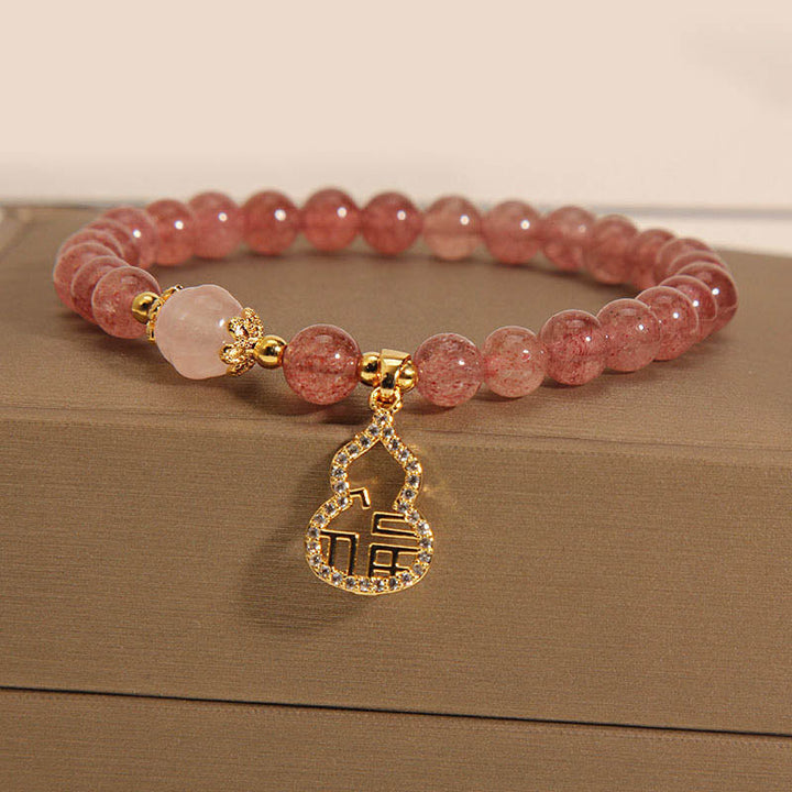 Armband Erdbeerquarz Fu-Zeichen rosafarbene Perlen Glücksbringer elegant