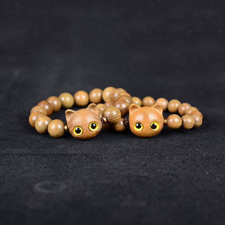 Sandelholz Katzen Armband mit gelben Augen elastisch Perlen