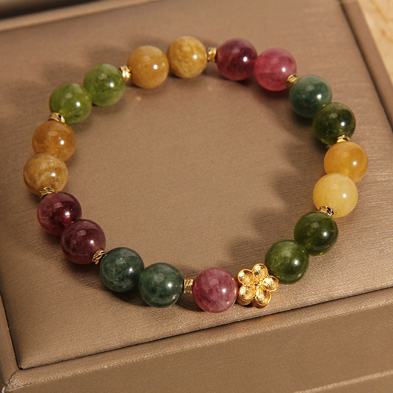 Buntes Turmalin Armband mit goldener Blume Naturstein elastisch.
