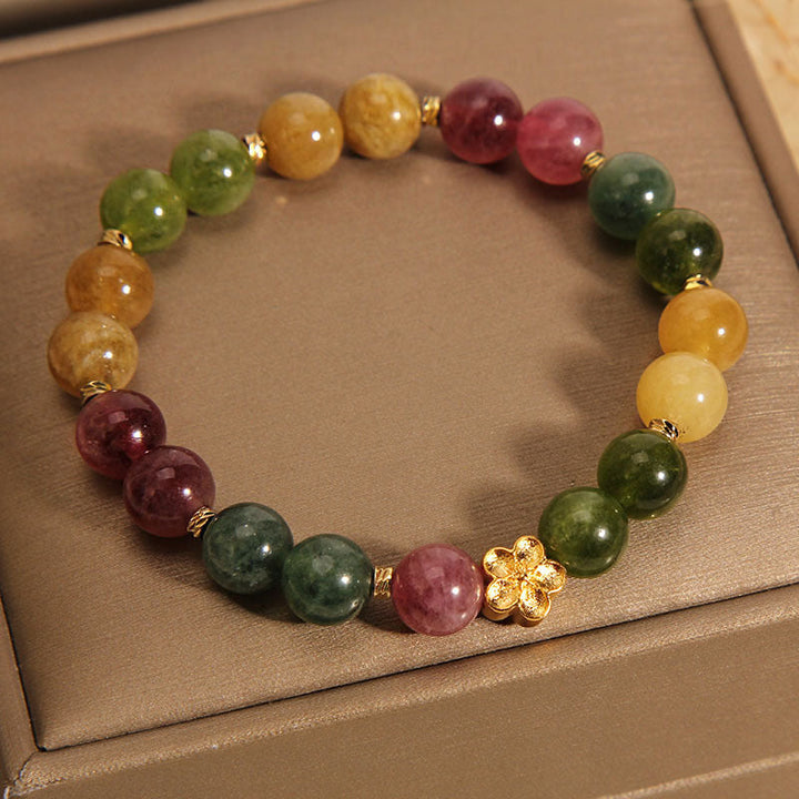 Buntes Turmalin Armband mit goldener Blume Naturstein elastisch.