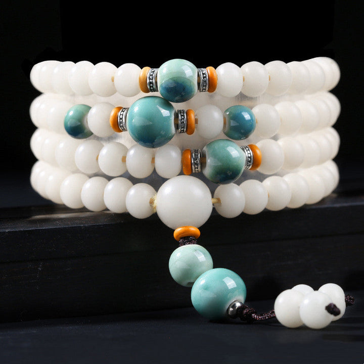 Armband Bodhi Lotus – Segen weiße Perlen Türkis elastisch Schmuck