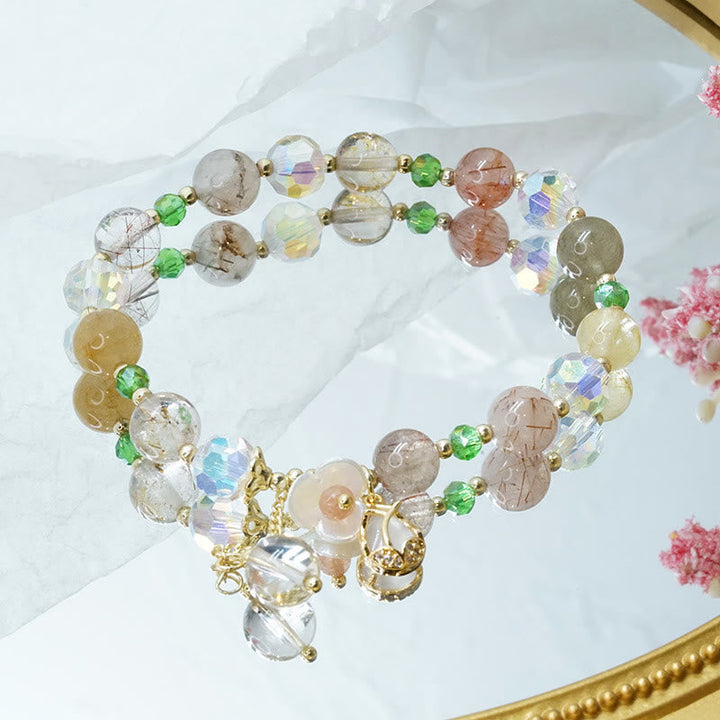 Armband Erdbeerquarz Fluorit – Heilung elegantes Perlenarmband displayed