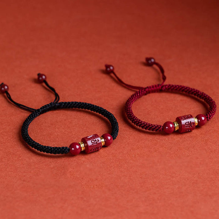 Armband Zinnober Rot "Om Mani Padme Hum" Mantra Gravur Geflochten