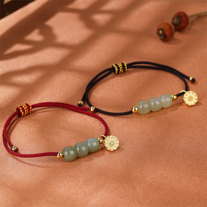 Jade Lotus Armband Glück Wohlstand zwei Farben Golddetails Handgelenk.