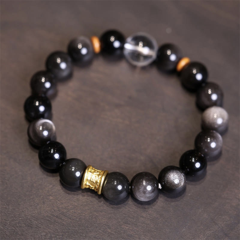 Schwarzes Obsidian Armband mit goldenen Spacern eleganter Schmuck