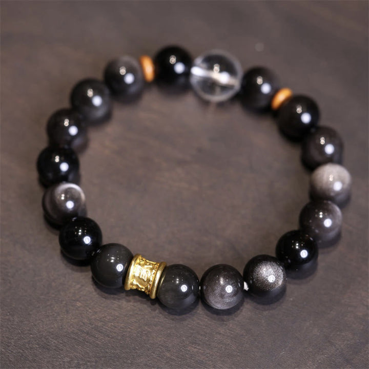 Schwarzes Obsidian Armband mit goldenen Spacern eleganter Schmuck