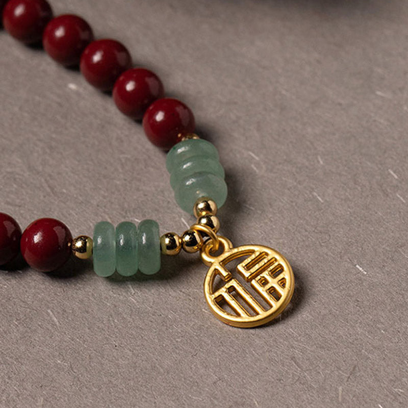 Armband Grüner Aventurin Zinnober rote Perlen goldener Anhänger Flachansicht