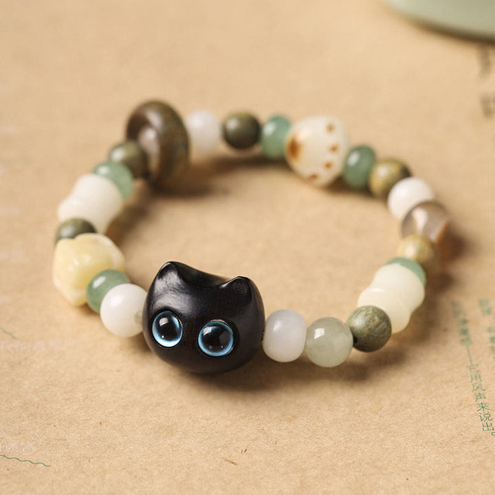 Armband Sandelholz Bodhi Katze mit grünen weißen Perlen elastisch