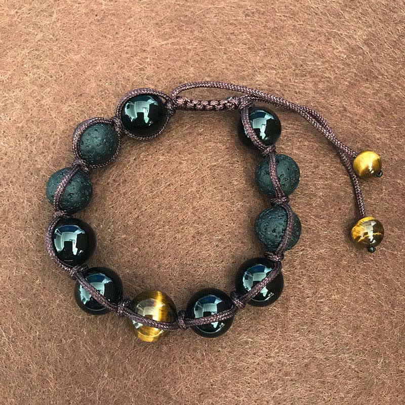 Armband Tigerauge – Heilung schwarze Perlen goldene Akzente elastisch