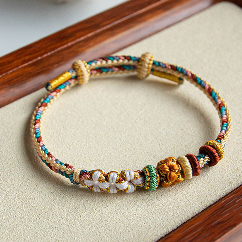 Buntes Armband Pfirsichblüte mit goldenen Perlen Stoffband elastisch.