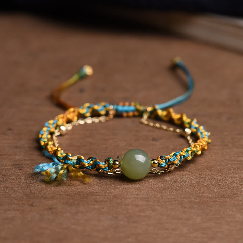 Jade Armband mit blauem Seidenfaden und goldenen Perlen Glück.