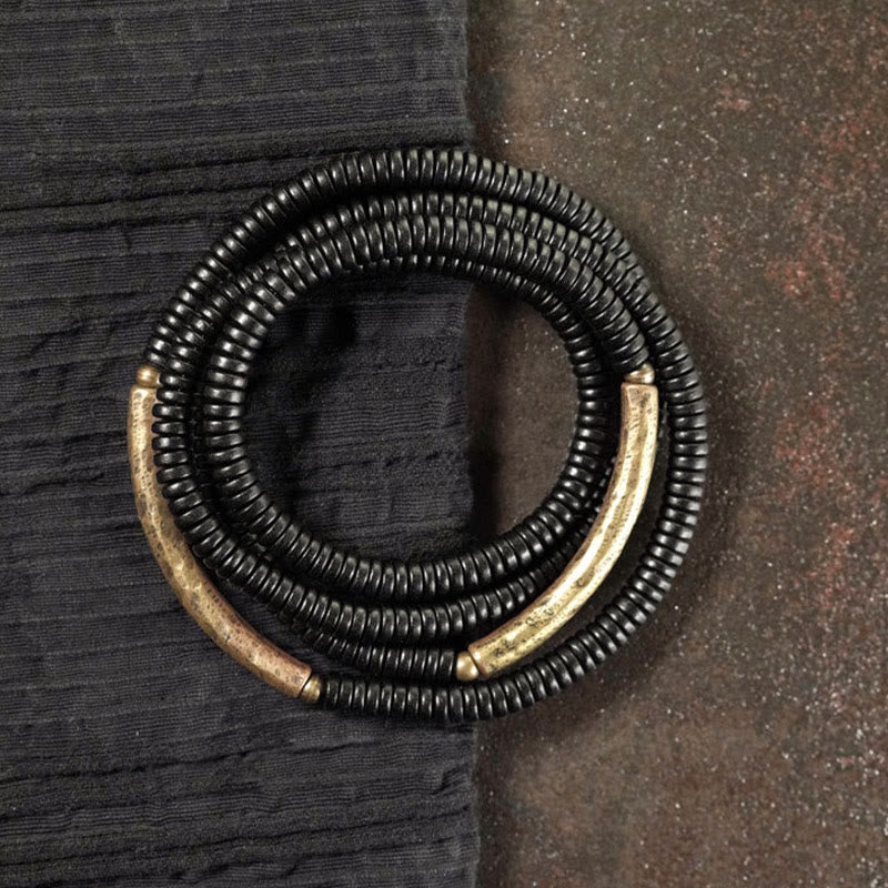 Armband Kupfer Ebenholz Balance schwarze Perlen Metallakzente elegant