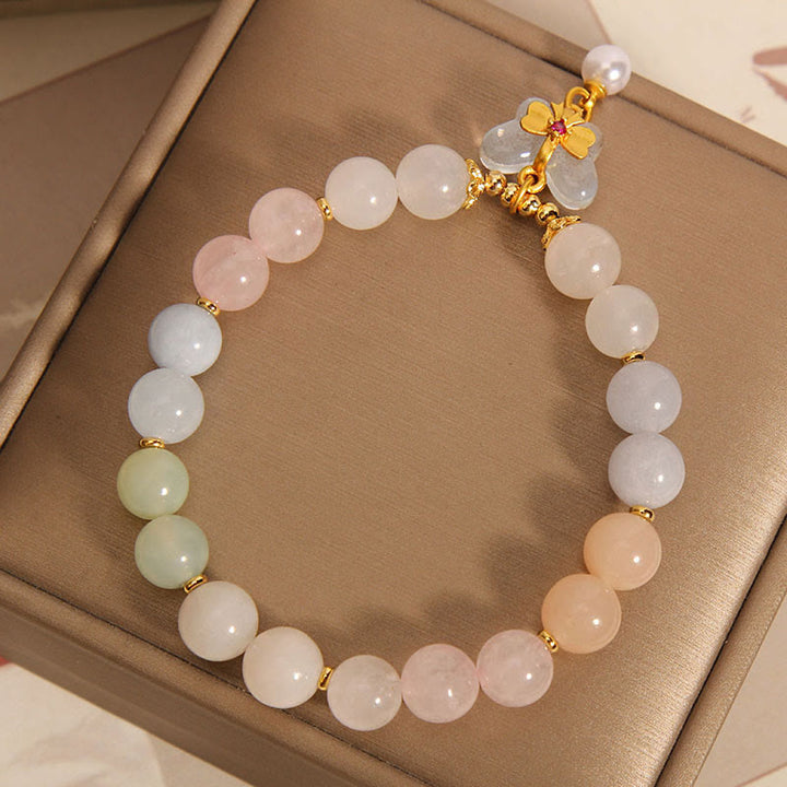 Armband Schmetterling Balance Rosenquarz Perlen Gold Charm elegant.