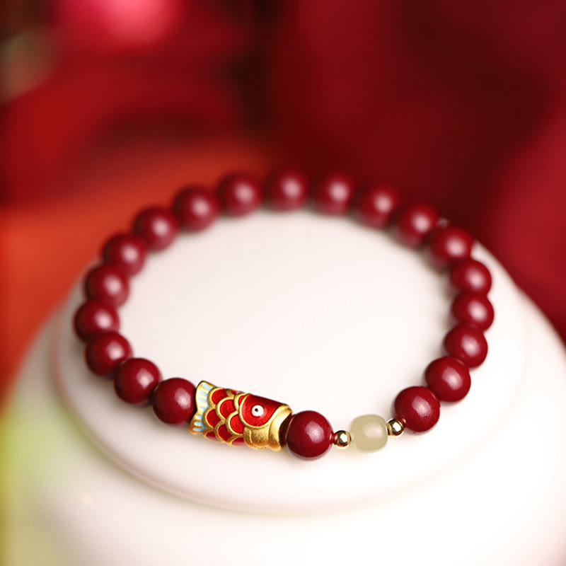 Armband Zinnober Jade Koi Fisch am Handgelenk Glück Segen elegant