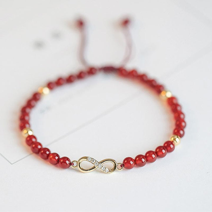 Rotes Achat Armband mit goldenem Kleeblatt Charm elastisch