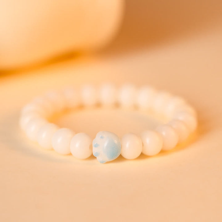 Bodhi Armband mit weißen Perlen und blauem Naturstein Glück