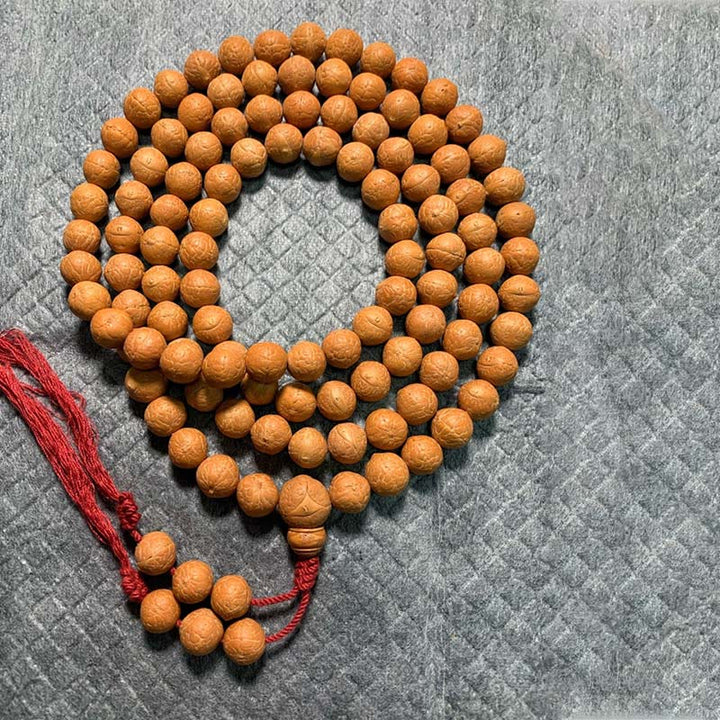 Mala Bodhi Halskette aus Holzperlen mit roter Kordel Glück Wohlstand.