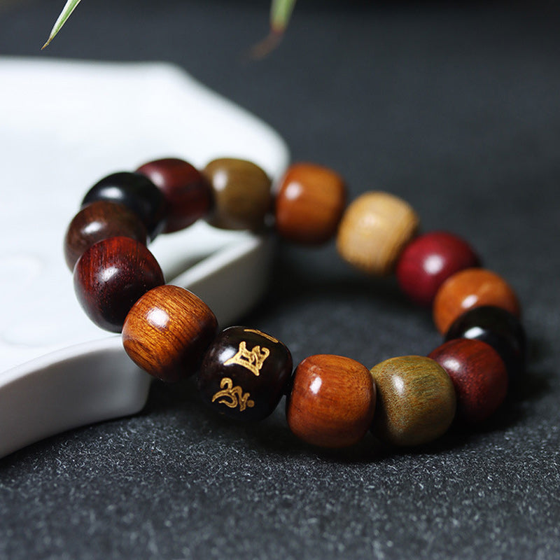 Armband Om Mani Padme Hum Tibet Holzperlen verschiedene Farben elastisch.